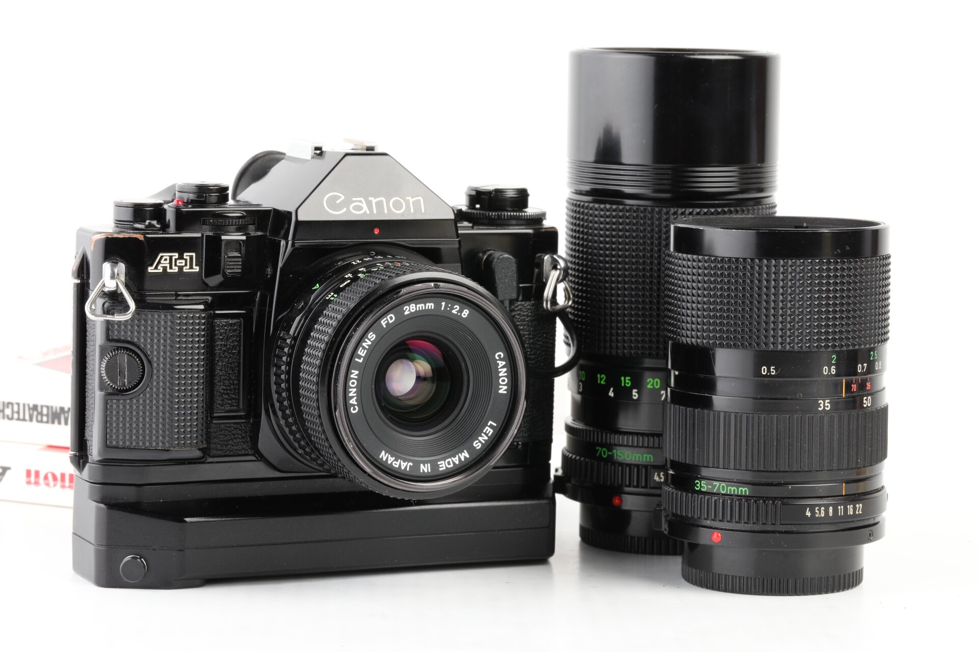 Canon A-1 +Power Winder A2 + FD 28mm f2,8 + FD 35-70 f4  + FD 70-150mm f4,5 + Data Back A